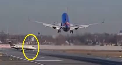 A very close call: A plane narrowly misses business jet at Chicago's Midway Airport