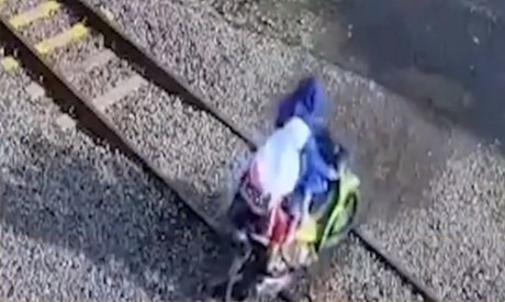 CCTV Footage: Motorcycle stuck on train track, train crushed the motorcycle