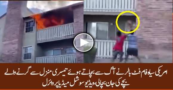 Dramatic Moment American Footballer Catches A Child Thrown From A Burning Building