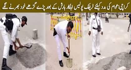 Heroic Act: Karachi Traffic Police Began Filling Potholes On The Road Themselves