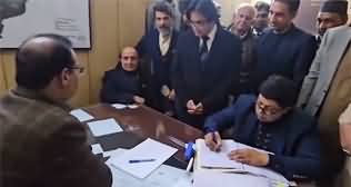 Latif Khosa submitting his nomination papers in front of Returning Officer