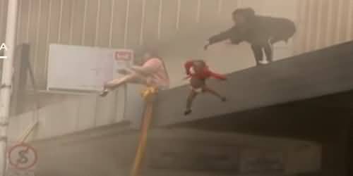 Mother Saves Her Baby By Throwing Her From A Building 'Set on Fire By Looters' in South Africa