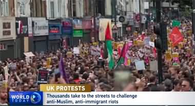 Thousands take to the streets to challenge anti-Muslim, anti-immigrant riots in the UK