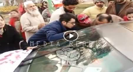 Watch What PTI Workers Doing With A Person in Car, Is This Naya Pakistan?